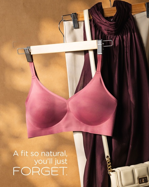 This creative showcases a comfort bra hanging against a neutral, warm-toned backdrop, emphasizing a clean and aspirational brand aesthetic.